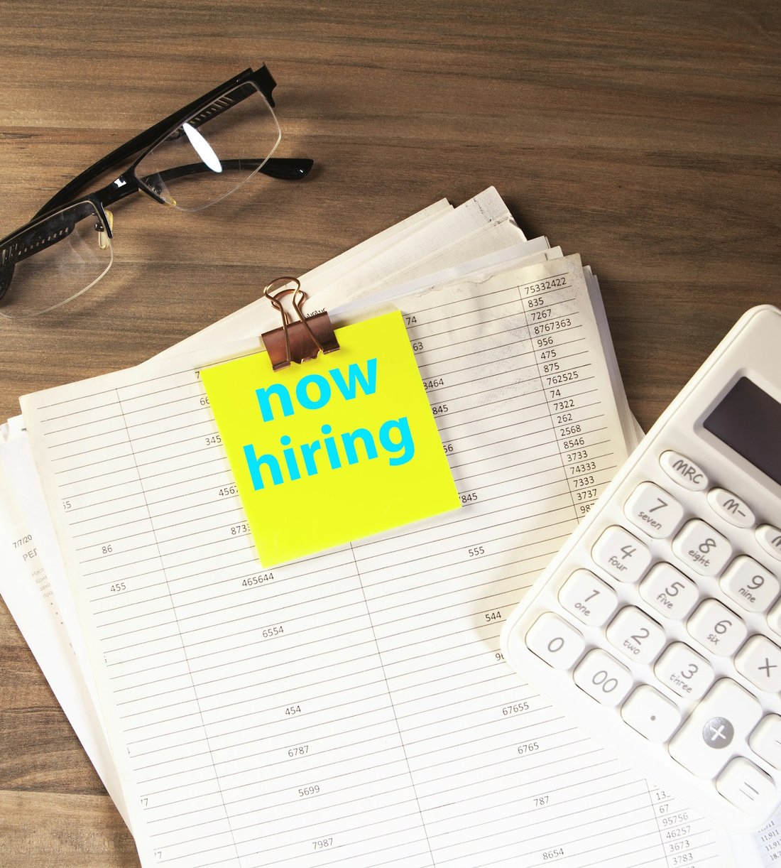 Now hiring note on a desk, representing new driver opportunities