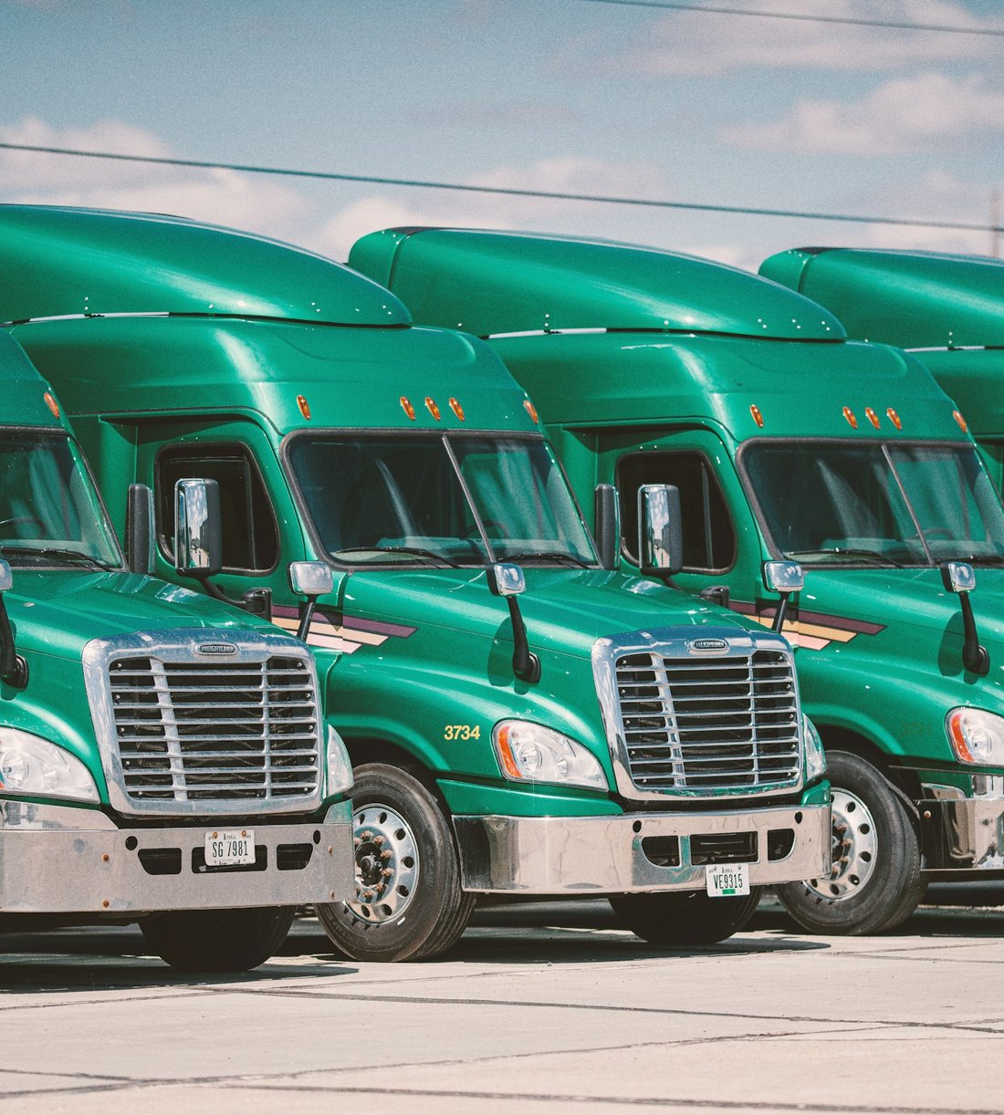 Fleet of HGV trucks lined up ready for dispatch